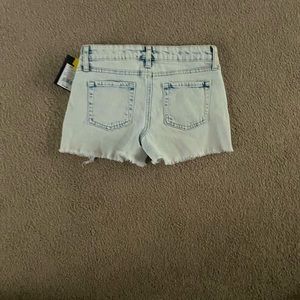 10-12 year old ripped jeans. Cute light blue and white color.